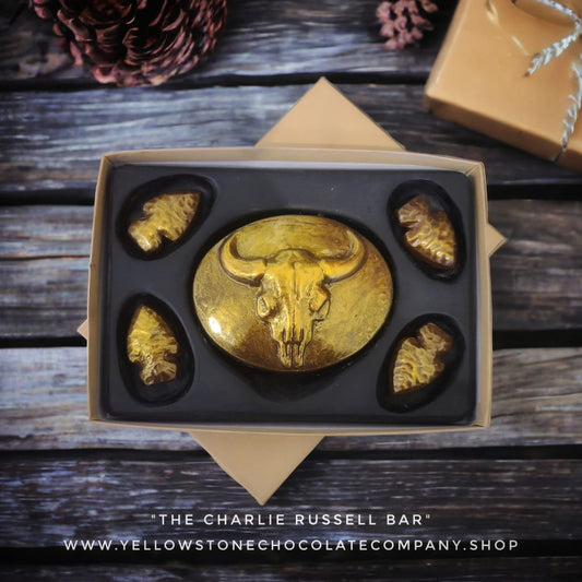 Gold chocolate bar with bull skull design and arrowheads, made in Bozeman, Montana
